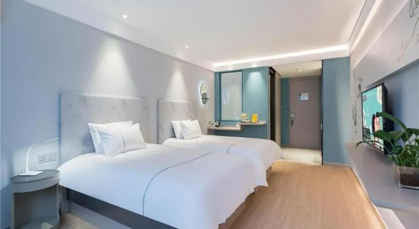 Bed in Magnotel Hotel Suzhou Wanda Plaza Huaihai Road