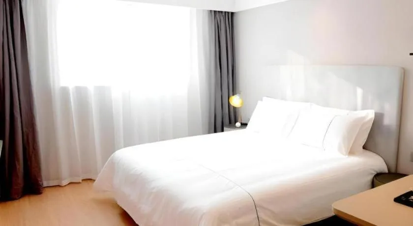 Bed in Magnotel Hotel Xuzhou Xinxin Yurun Plaza Zhongwu Road