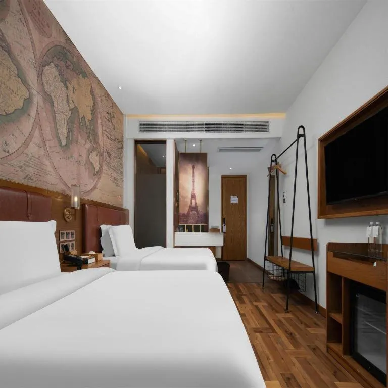 Bed in James Joyce Coffetel Luoyang Longmen High-speed Railway Station Baolong Plaza