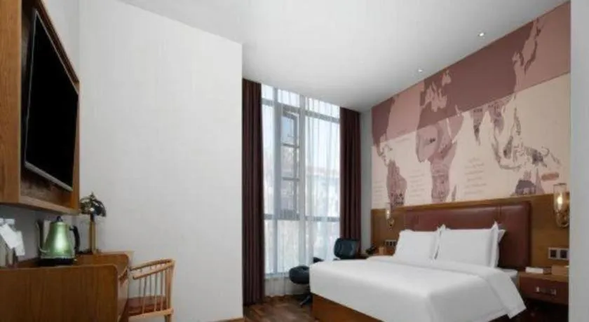 Bed in James Joyce Coffetel Luoyang Longmen High-speed Railway Station Baolong Plaza