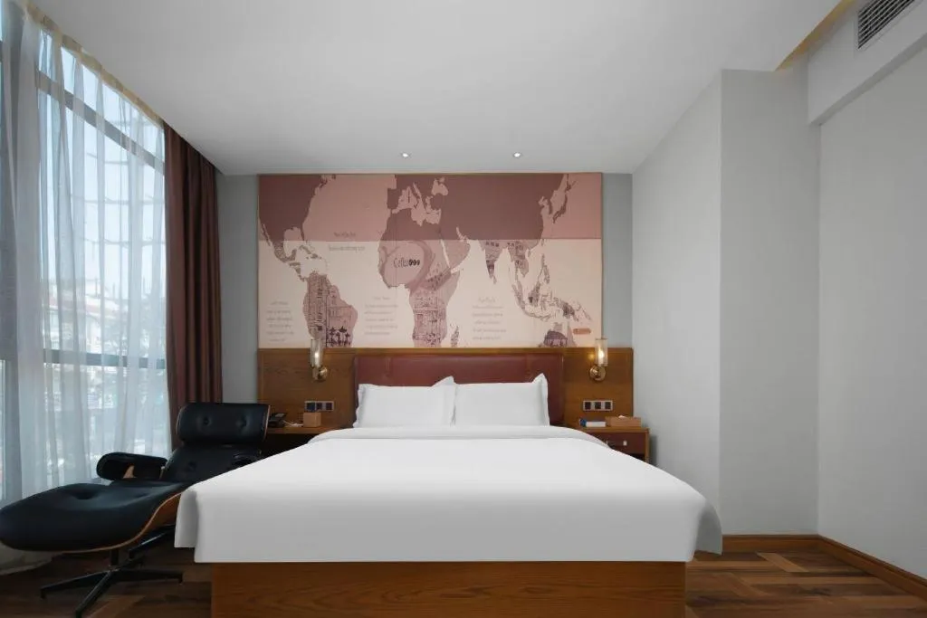 Bed in James Joyce Coffetel Luoyang Longmen High-speed Railway Station Baolong Plaza