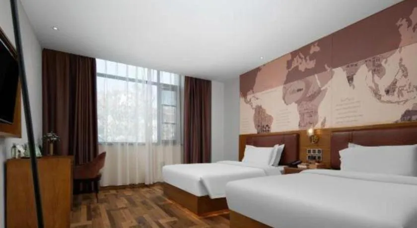 Bed in James Joyce Coffetel Luoyang Longmen High-speed Railway Station Baolong Plaza