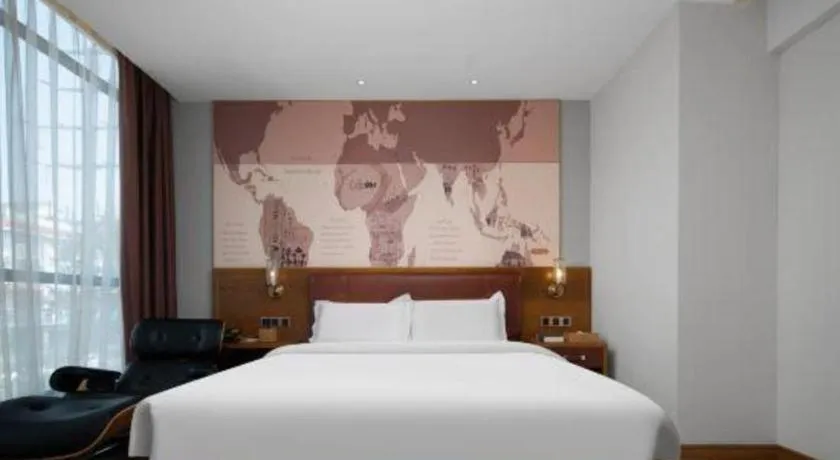 Bed in James Joyce Coffetel Luoyang Longmen High-speed Railway Station Baolong Plaza