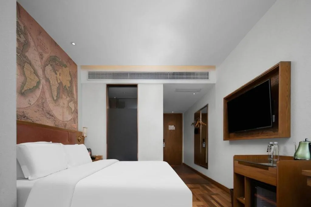 Bed in James Joyce Coffetel Luoyang Longmen High-speed Railway Station Baolong Plaza