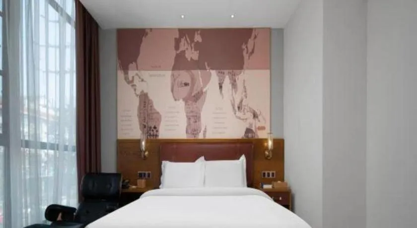 Bed in James Joyce Coffetel Luoyang Longmen High-speed Railway Station Baolong Plaza