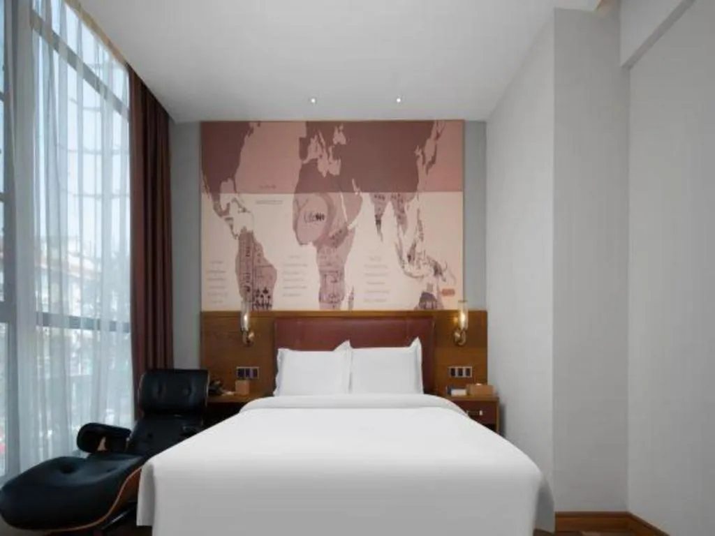 Bed in James Joyce Coffetel Luoyang Longmen High-speed Railway Station Baolong Plaza