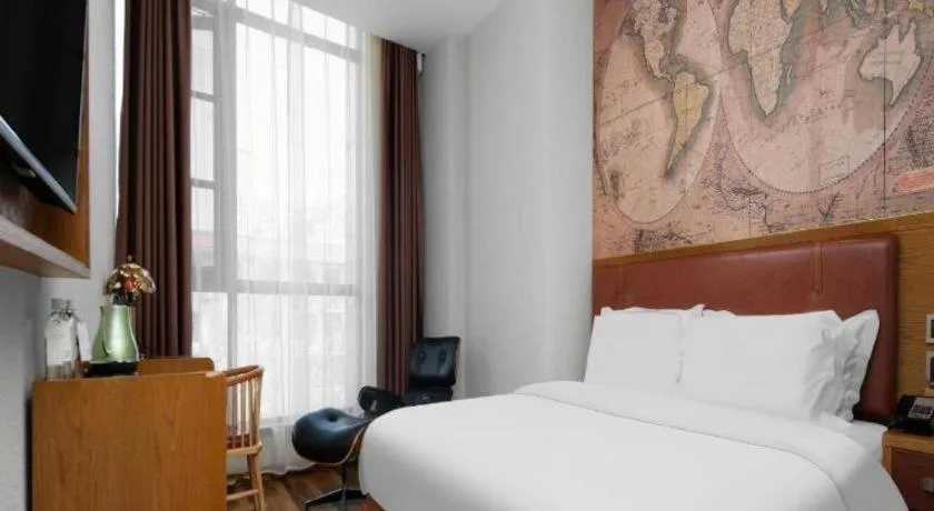 Bed in James Joyce Coffetel Luoyang Longmen High-speed Railway Station Baolong Plaza