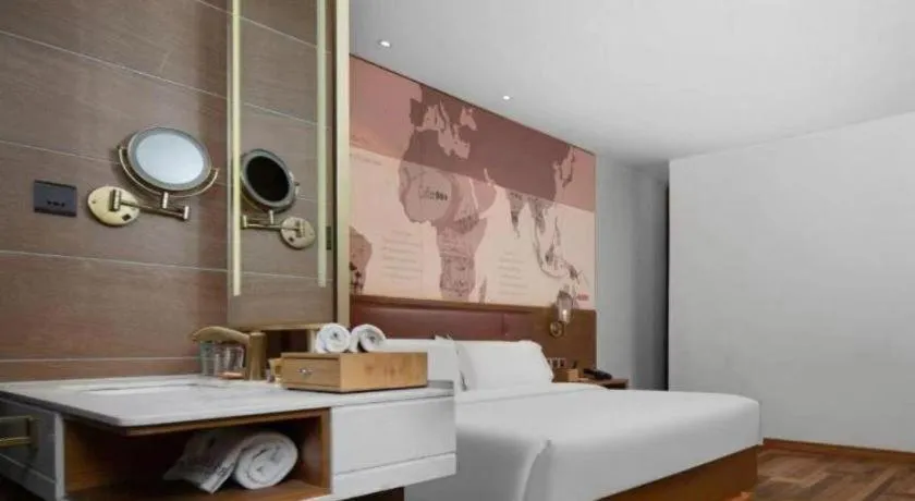 Bed in James Joyce Coffetel Luoyang Longmen High-speed Railway Station Baolong Plaza