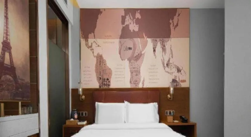 Bed in James Joyce Coffetel Luoyang Longmen High-speed Railway Station Baolong Plaza