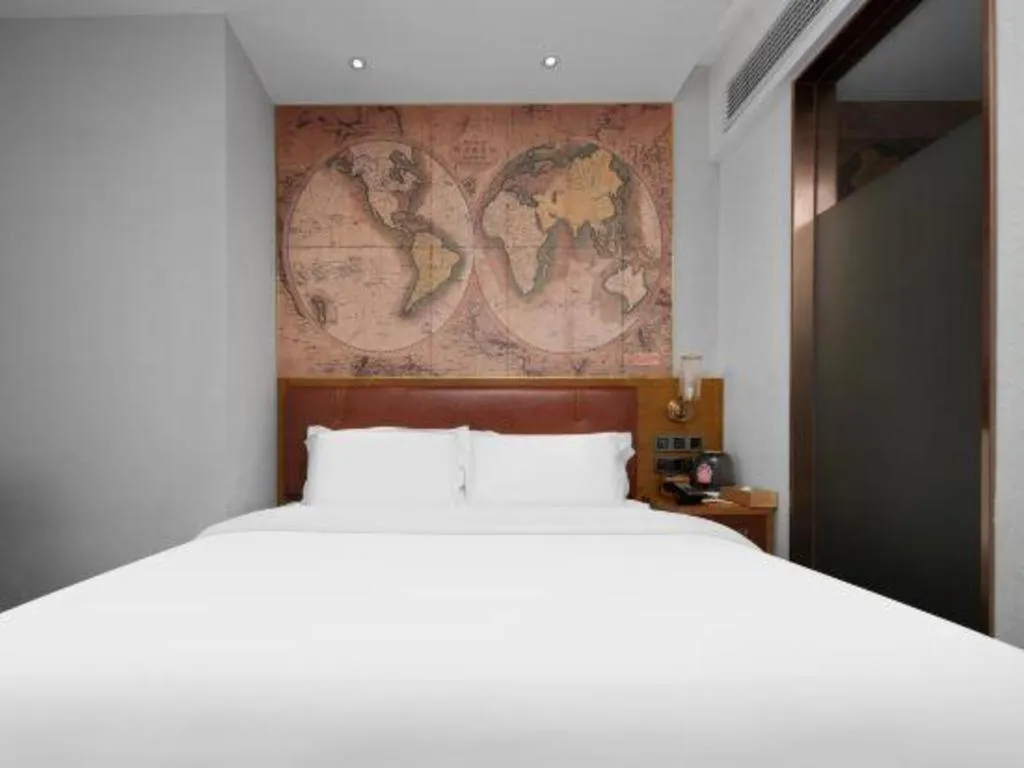 Bed in James Joyce Coffetel Luoyang Longmen High-speed Railway Station Baolong Plaza