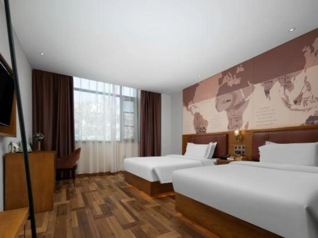 Bed in James Joyce Coffetel Luoyang Longmen High-speed Railway Station Baolong Plaza