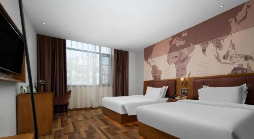 Bed in James Joyce Coffetel Luoyang Longmen High-speed Railway Station Baolong Plaza