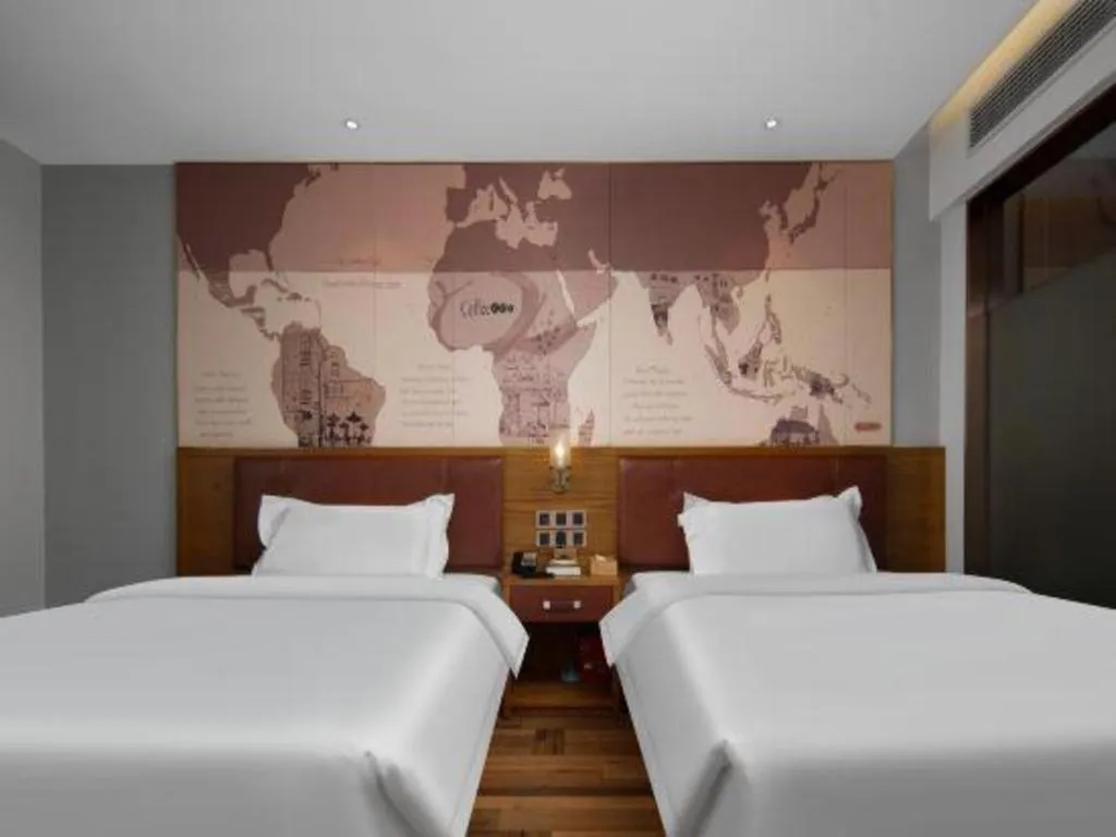 Bed in James Joyce Coffetel Luoyang Longmen High-speed Railway Station Baolong Plaza