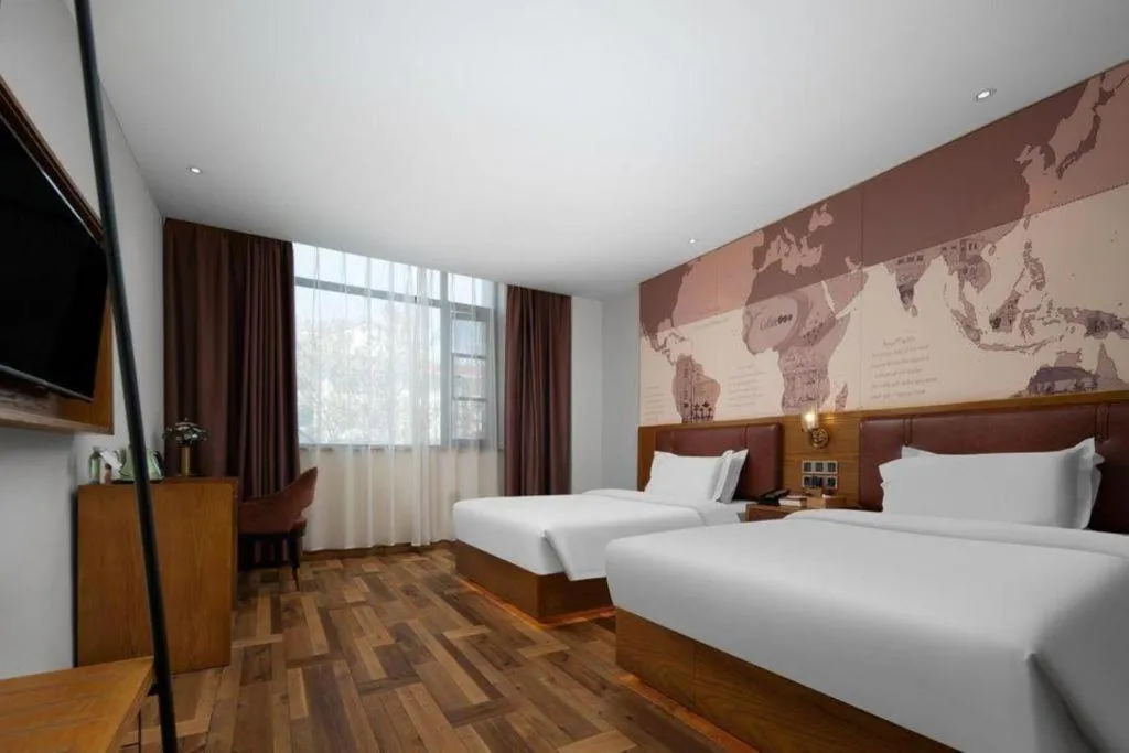 Bed in James Joyce Coffetel Luoyang Longmen High-speed Railway Station Baolong Plaza