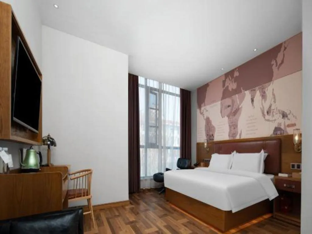 Bed in James Joyce Coffetel Luoyang Longmen High-speed Railway Station Baolong Plaza