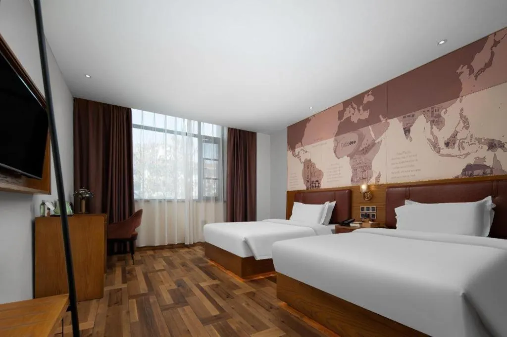 Bed in James Joyce Coffetel Luoyang Longmen High-speed Railway Station Baolong Plaza