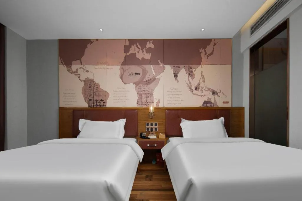 Bed in James Joyce Coffetel Luoyang Longmen High-speed Railway Station Baolong Plaza