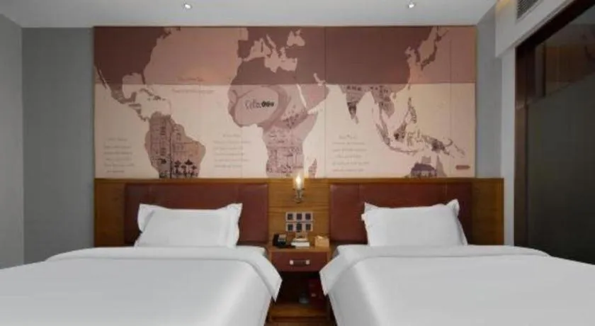 Bed in James Joyce Coffetel Luoyang Longmen High-speed Railway Station Baolong Plaza