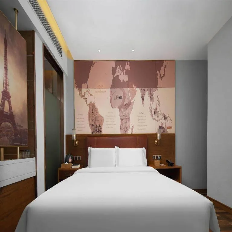 Bed in James Joyce Coffetel Luoyang Longmen High-speed Railway Station Baolong Plaza