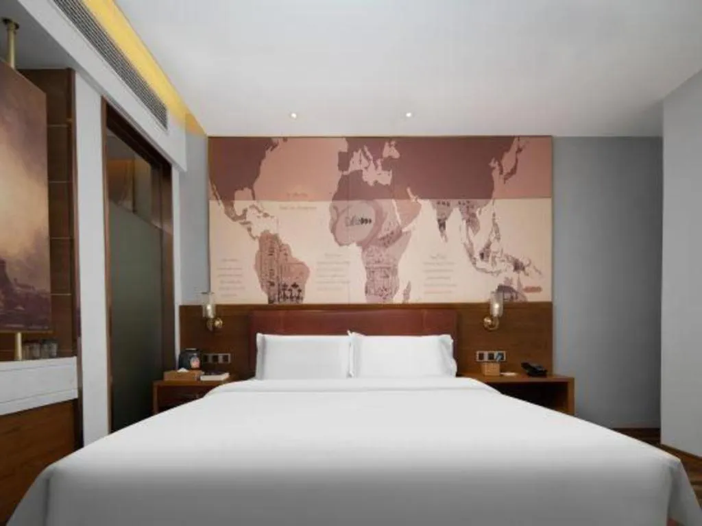 Bed in James Joyce Coffetel Luoyang Longmen High-speed Railway Station Baolong Plaza