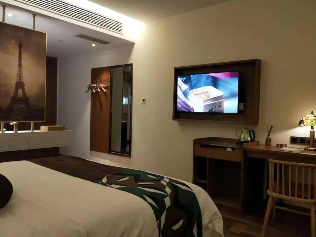Bed in James Joyce Coffetel Luoyang Longmen High-speed Railway Station Baolong Plaza