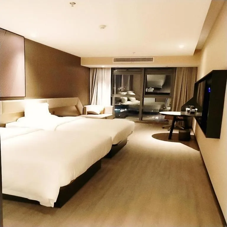 Bed in IU Hotel Chongqing Airport T3 Terminal