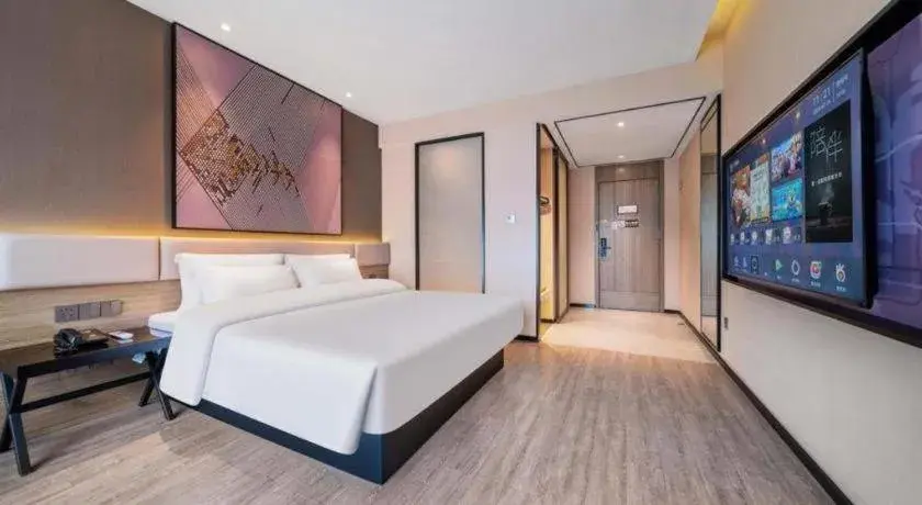 Bed in IU Hotel Chongqing Airport T3 Terminal Bed in IU Hotel Chongqing Airport T3 Terminal