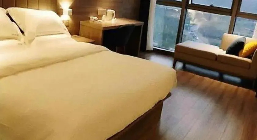 Bed in IU Hotel Chongqing Airport T3 Terminal Bed in IU Hotel Chongqing Airport T3 Terminal