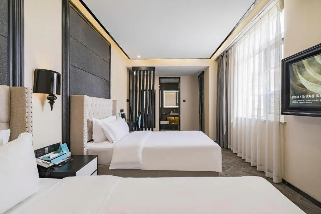 Bed in Xana Lite Hotelle Tianjin Huaming Binhai International Airport