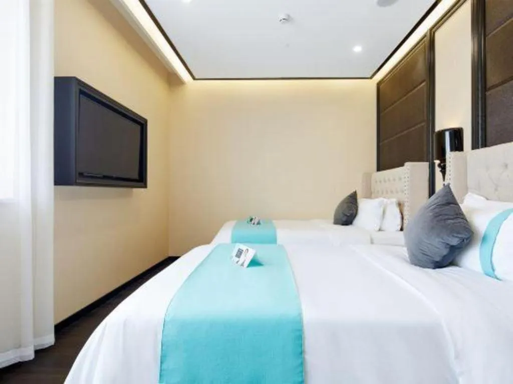 Bed in Xana Lite Hotelle Tianjin Huaming Binhai International Airport