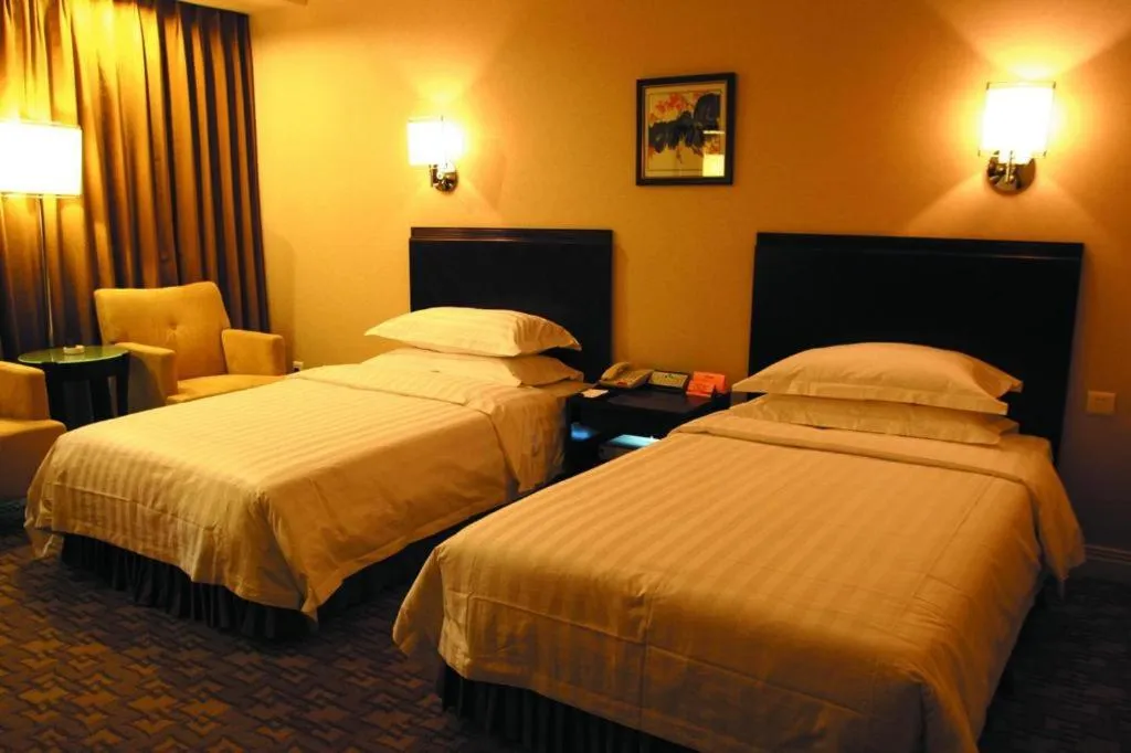 Bed in Jinjiang Hotel Qianan