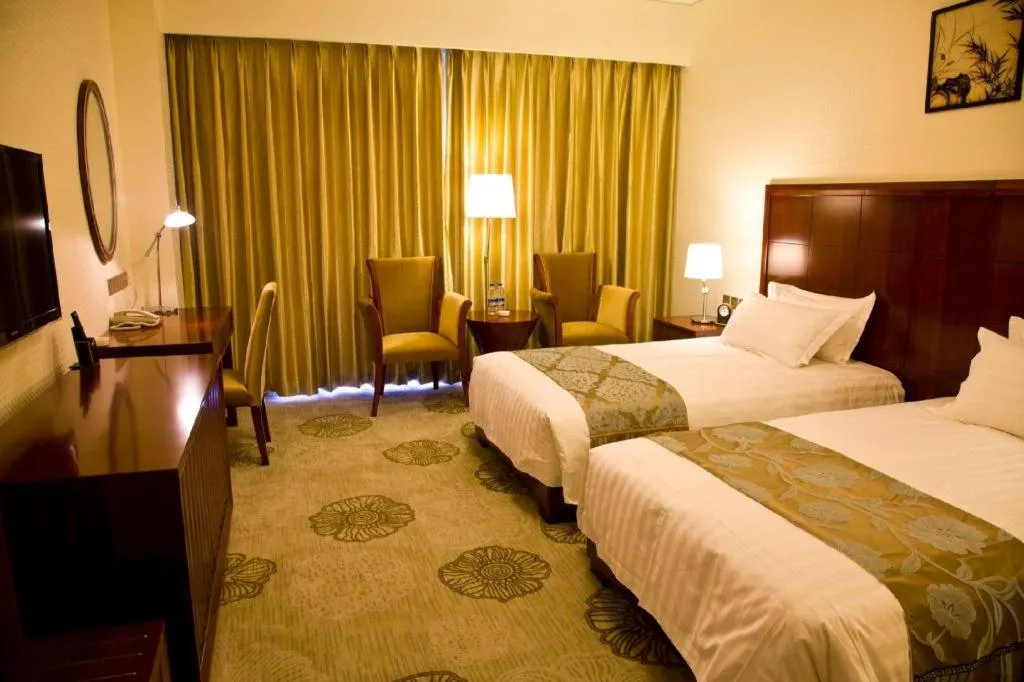 Bed in Jinjiang Hotel Qianan