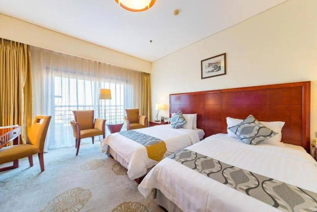 Bed in Jinjiang Hotel Qianan