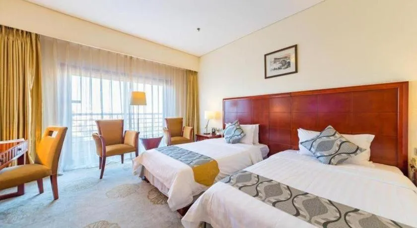 Bed in Jinjiang Hotel Qianan