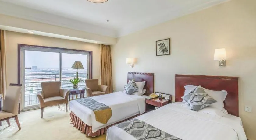 Bed in Jinjiang Hotel Qianan