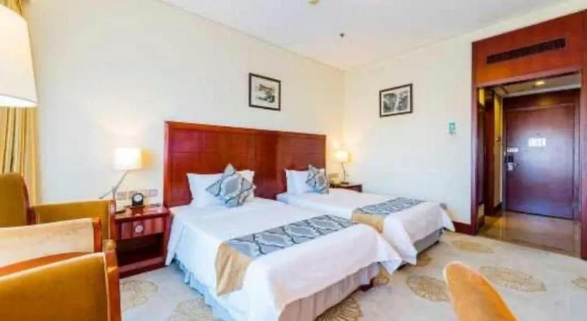 Bed in Jinjiang Hotel Qianan