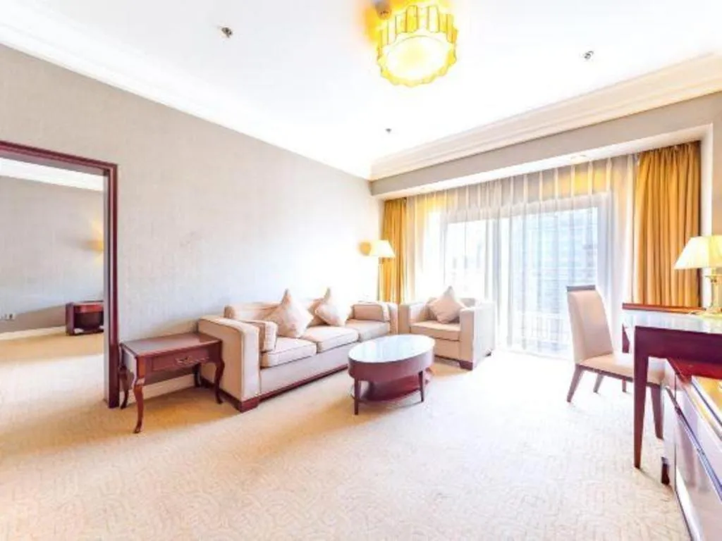 Bed in Jinjiang Hotel Qianan