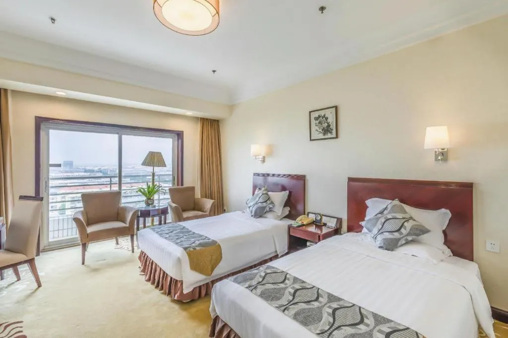 Bed in Jinjiang Hotel Qianan