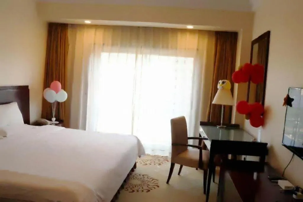 Bed in Jinjiang Hotel Qianan