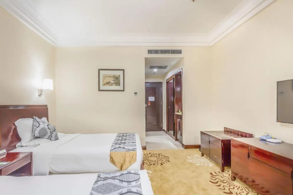 Bed in Jinjiang Hotel Qianan