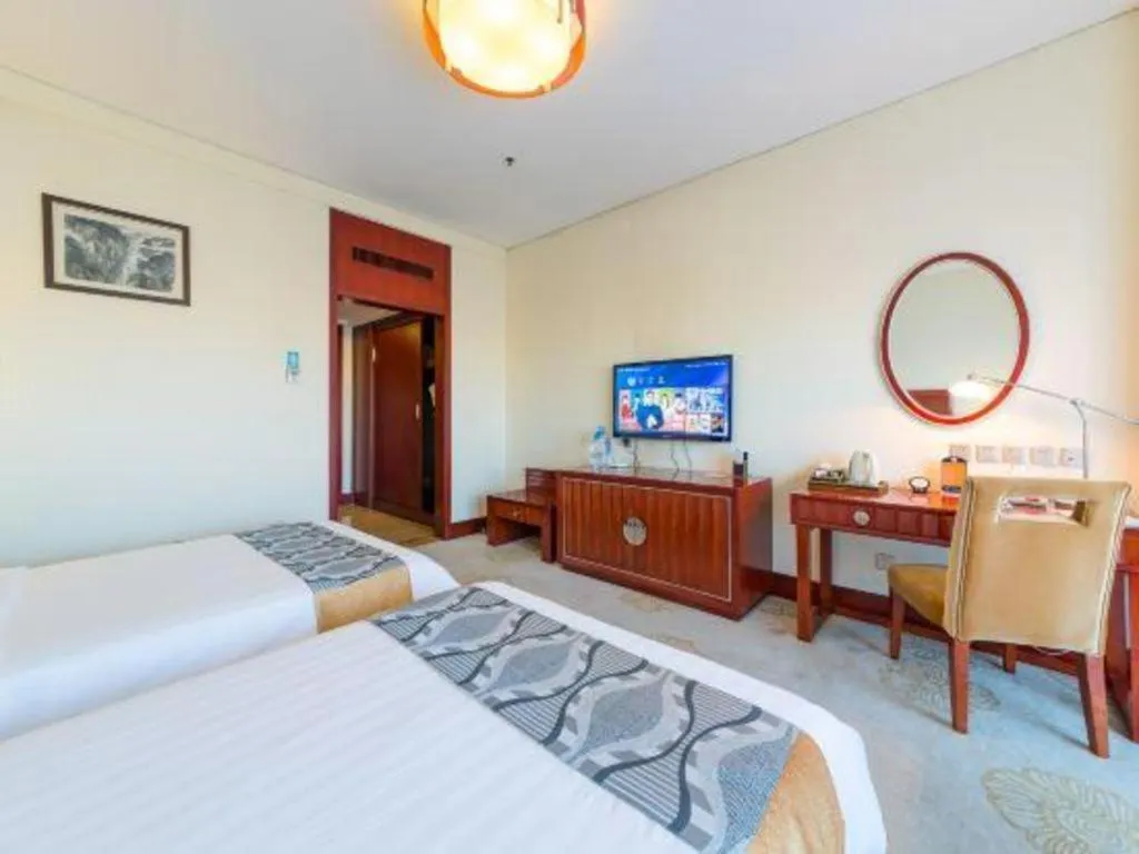 Bed in Jinjiang Hotel Qianan