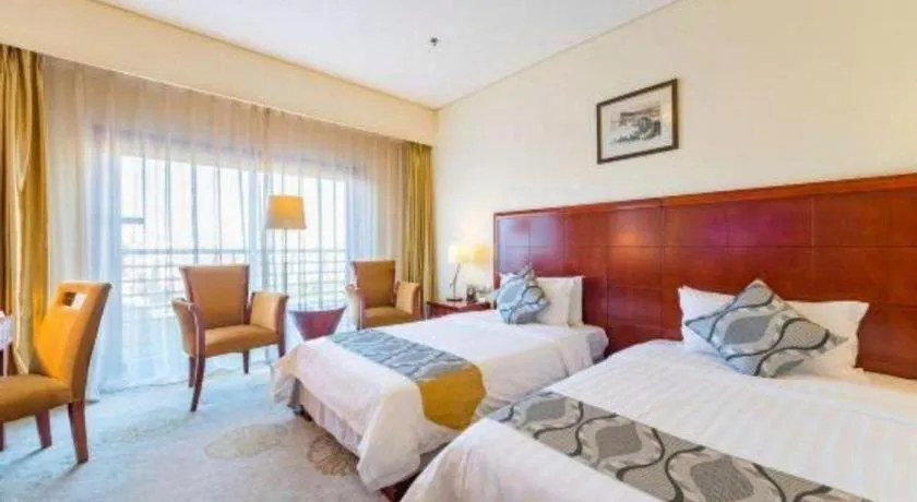 Bed in Jinjiang Hotel Qianan