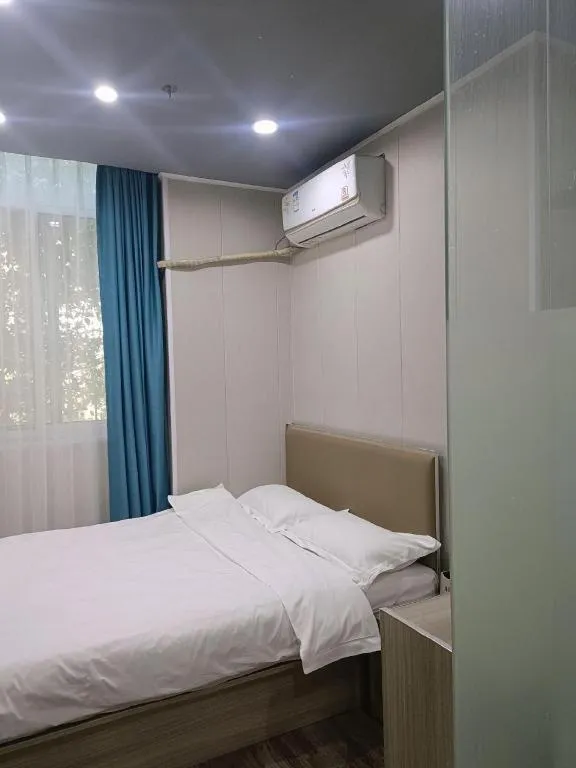 Bed in Shell Hotel Taixing Huangqiao Town Dinghui Road