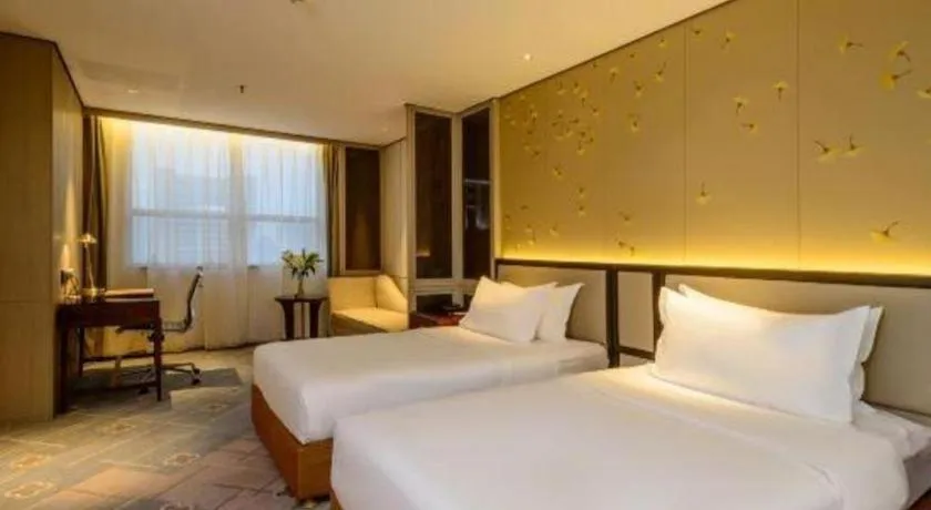 Bed in Dahe Jinjiang Hotel