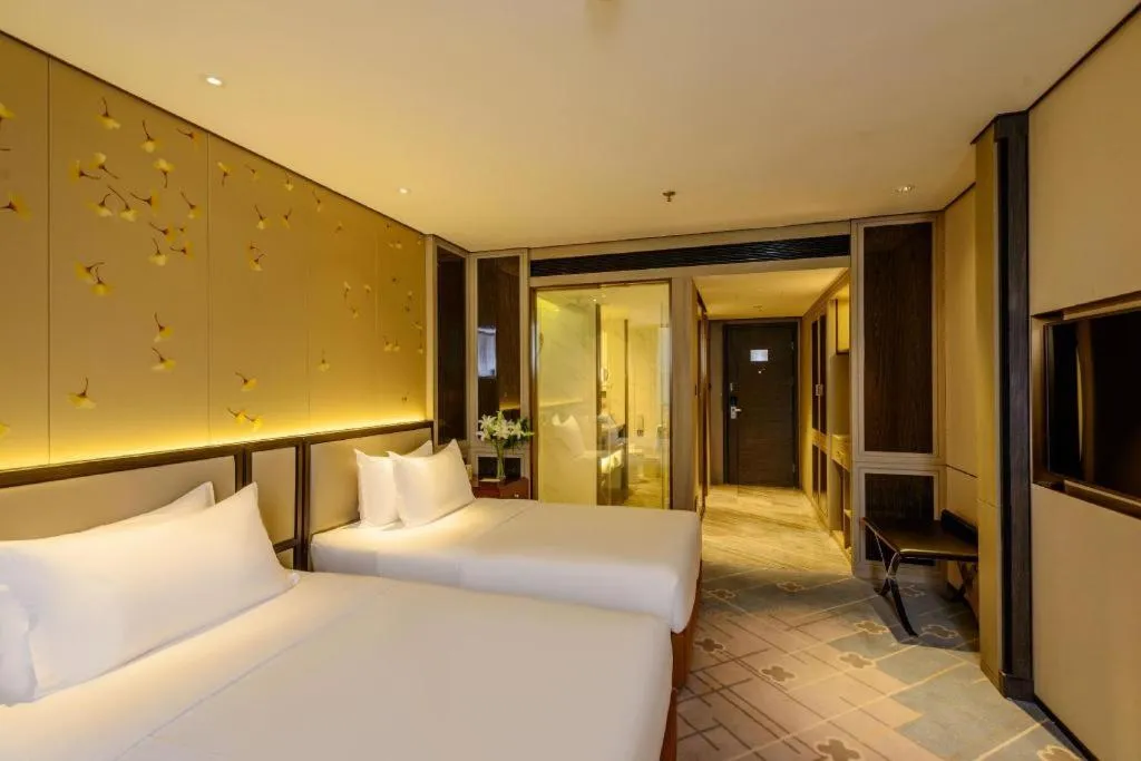 Bed in Dahe Jinjiang Hotel
