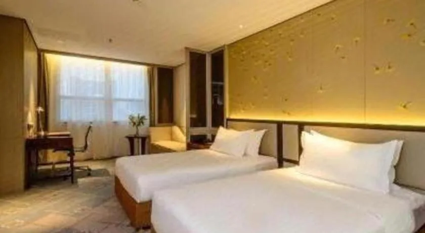 Bed in Dahe Jinjiang Hotel
