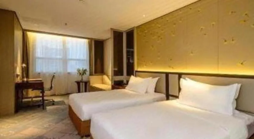 Bed in Dahe Jinjiang Hotel