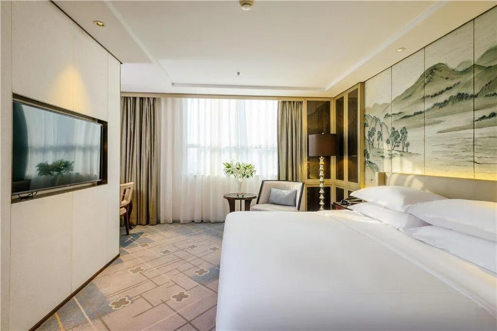 Bed in Dahe Jinjiang Hotel