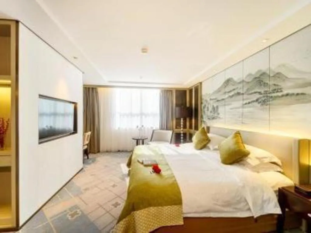 Bed in Dahe Jinjiang Hotel
