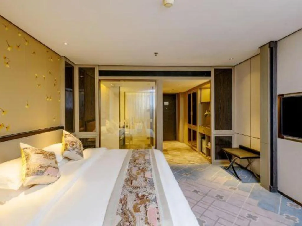 Bed in Dahe Jinjiang Hotel